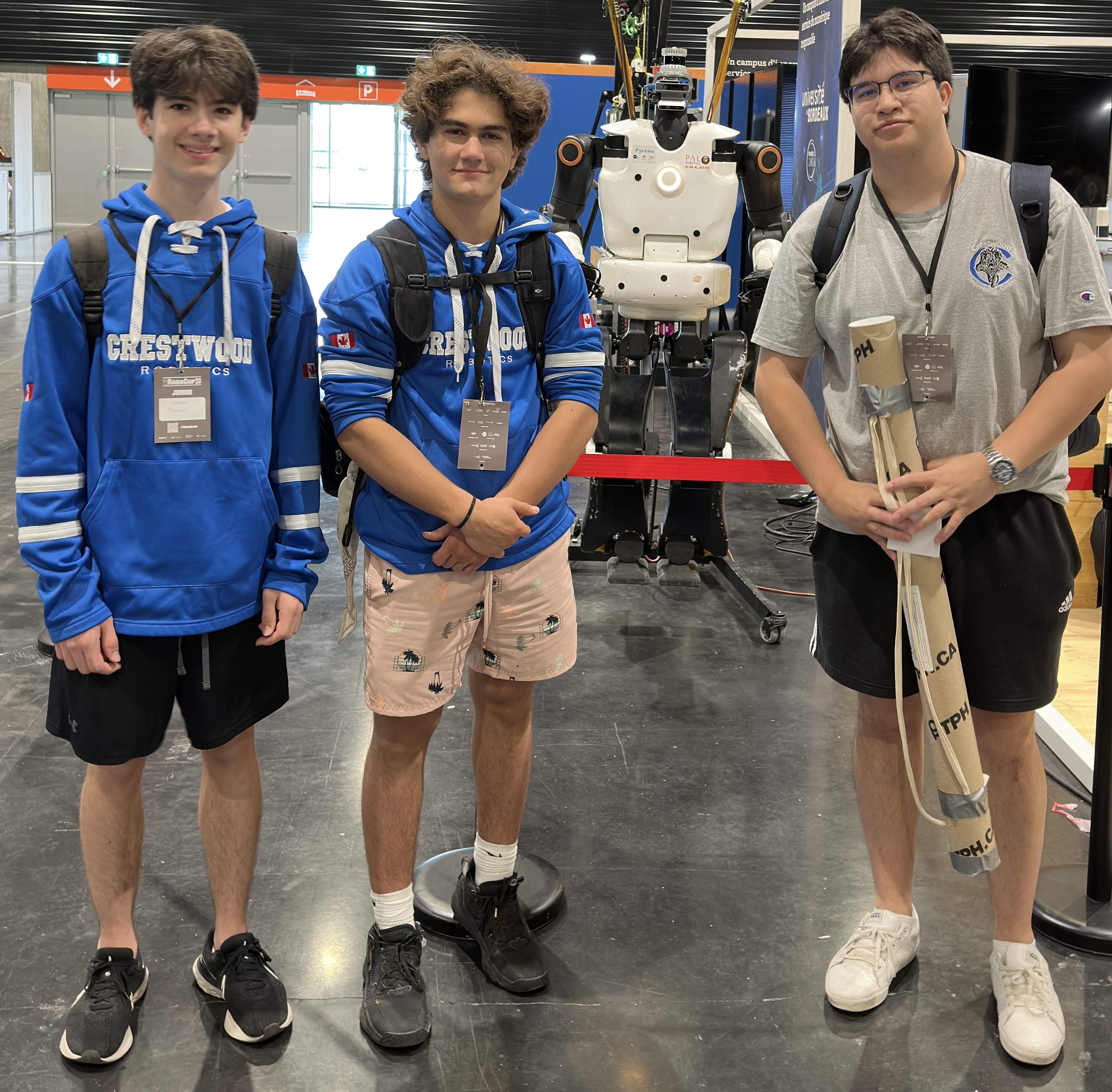 Team standing in front of robot